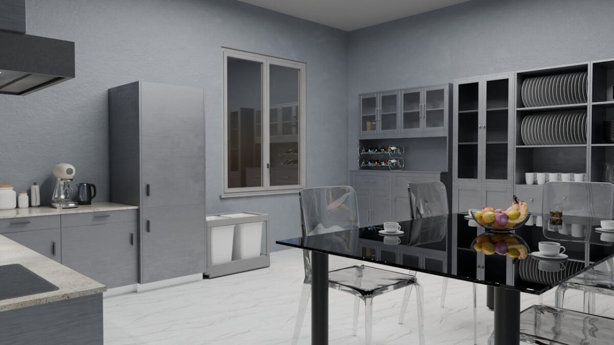 gallery-02 Sleek modern kitchen with glass table, gray cabinets, and decor elements for stylish living.